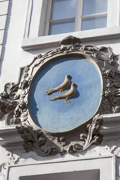 Relief on facade of old building, birds,  Nerudova street, Prague, Czech Republic