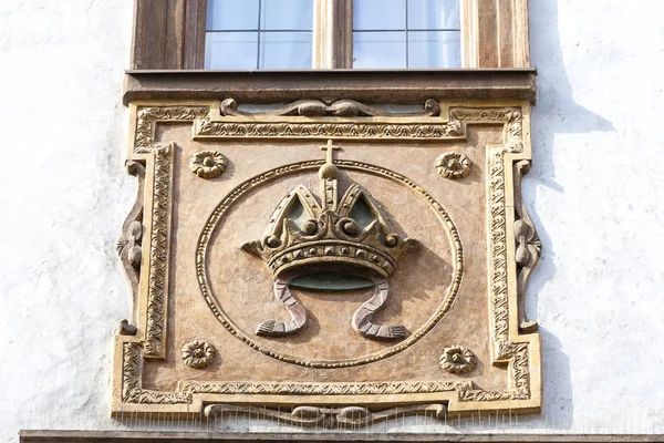 Relief on facade of old building, stone crown, Prague,  Czech Republic