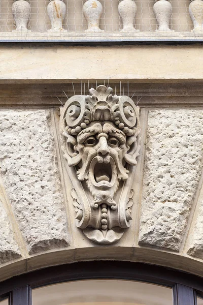 Relief on facade of old building, mascaron ornament, Prague, Czech Republic