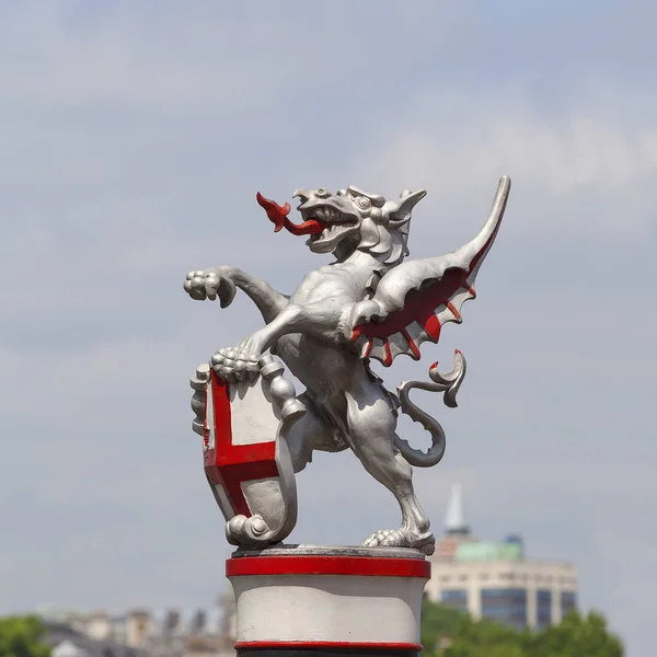 Coat of arms of the City of London, city border marker: single iron dragon holding a shield, London, United Kingdom. — Stock Photo, Image