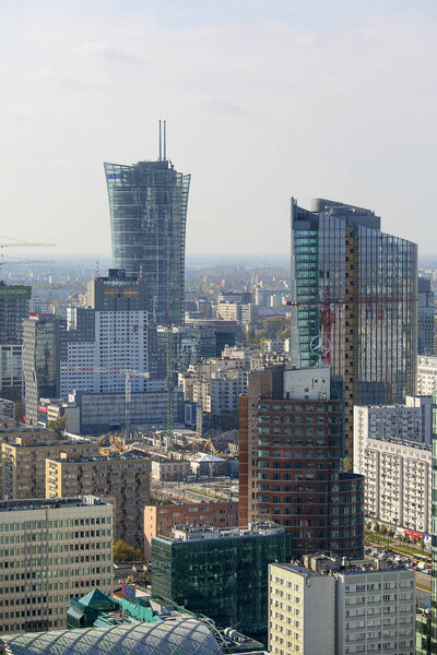 WARSAW, POLAND -OCTOBER 18, 2019: Aerial view of the modern buildings of the city, residential and office skyscrapers, Warsaw Spire