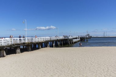 SOPOT, POLAND - JUNE 6, 2018: Wooden Sopot pier in sunny day., Baltic Sea. It is the longest wooden pier in Europe, 511,5 m long