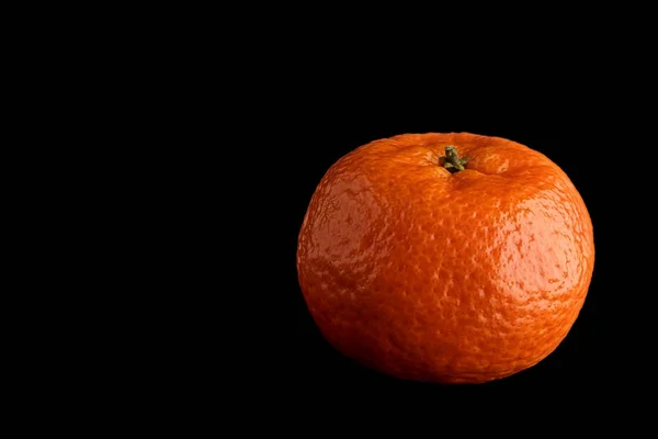 Tangerine on black background — Stock Photo, Image