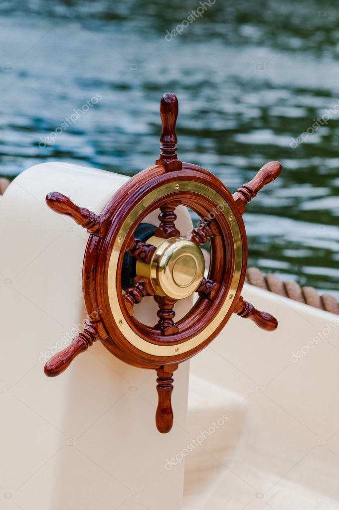 https://st3.depositphotos.com/1410528/12687/i/950/depositphotos_126871672-stock-photo-ship-helm-steering-wheel-boat.jpg