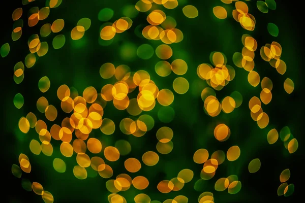 Bokeh achtergrond gloeiende ovaal gevormde gloed donker geel groen gemengd leeg — Stockfoto