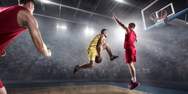 Basketball players on big professional arena