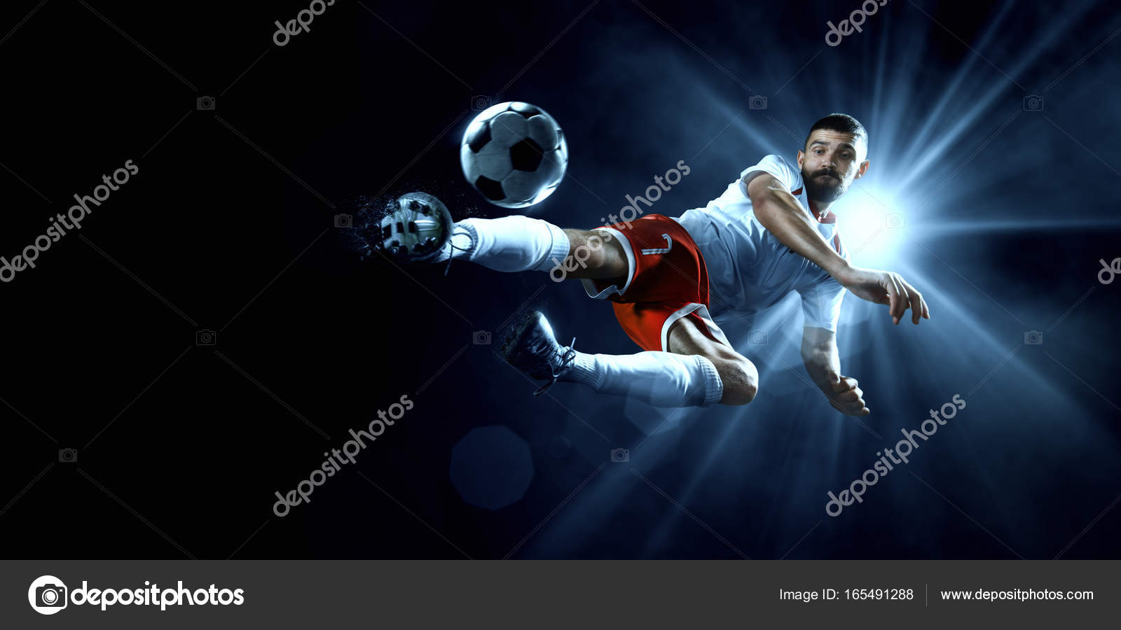 Soccer player performs an action play on a professional stadium — Stock