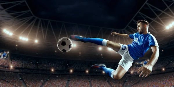 Soccer player performs an action play on a professional stadium — Stock Photo, Image