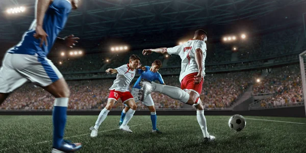 Soccer players performs an action play on a professional stadium