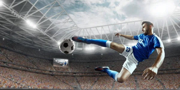 Soccer player performs an action play on a professional stadium