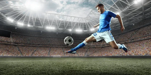 Soccer player performs an action play on a professional stadium