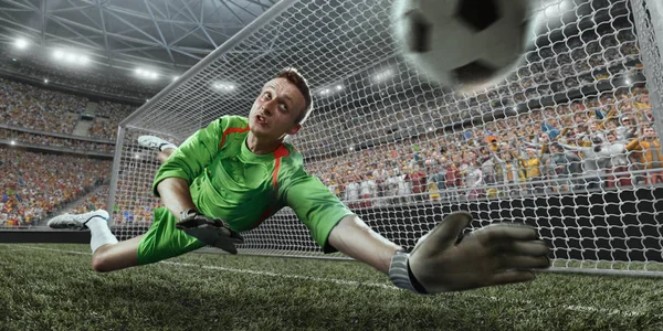 Soccer goalkeeper catches a ball — Stock Photo, Image