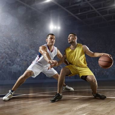 Basketball players on big professional arena clipart