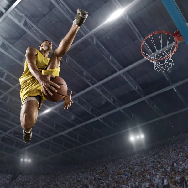 Basketball player makes slam dunk