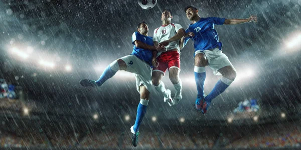 Soccer players performs an action play on a professional stadium — Stock Photo, Image