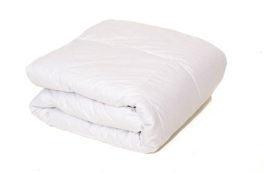 Rolled white duvet cover on white isolated background clipart