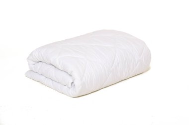 Rolled white duvet cover on white isolated background clipart
