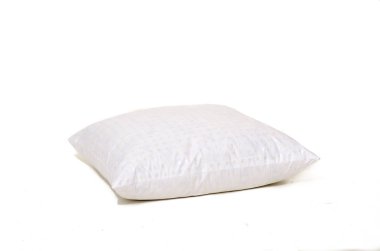 Beyaz arka plandaki beyaz yastığı kapat