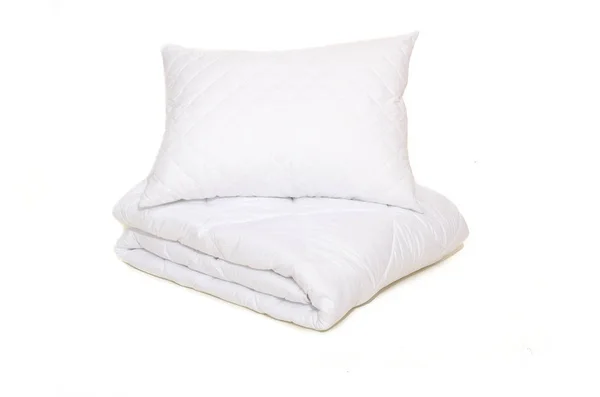 Rolled white duvet cover on white isolated background