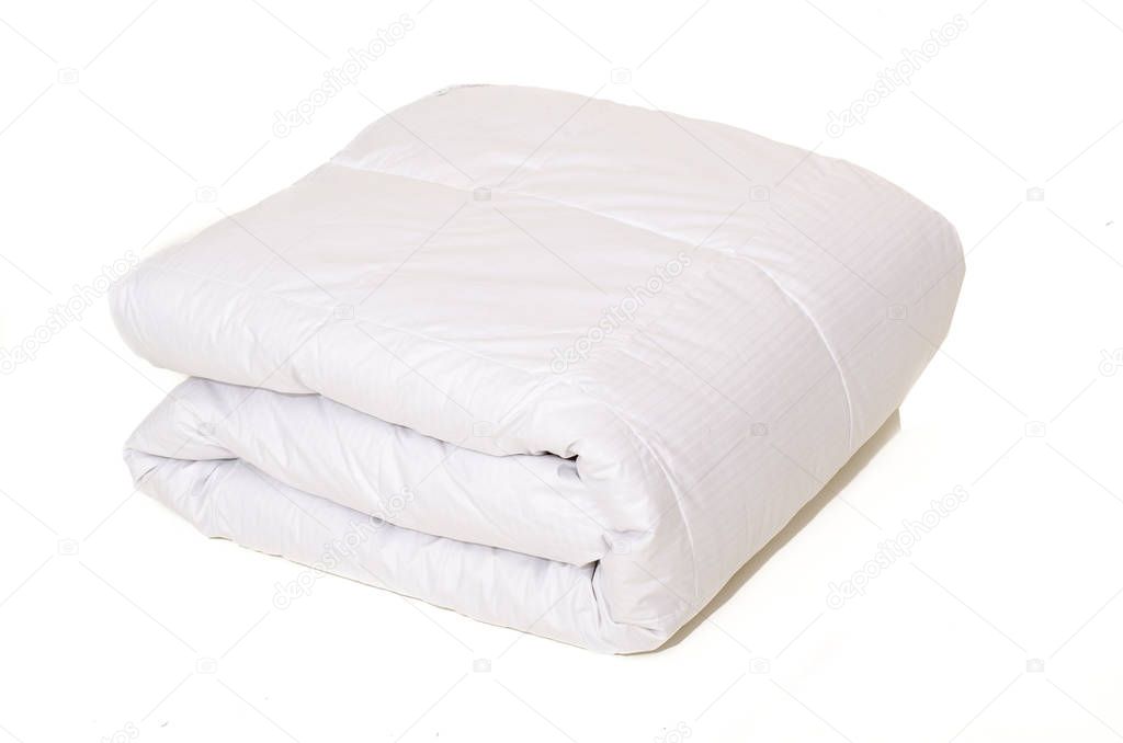 Rolled white duvet cover on white isolated background