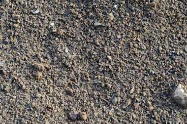 Çakıl yığını ile endüstriyel arka plan. Çakıl çıkarılması. Yollarının yapımı. Şantiye çakıl yığınları.