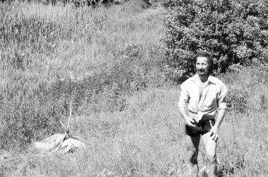 man resting outside the city on the beach