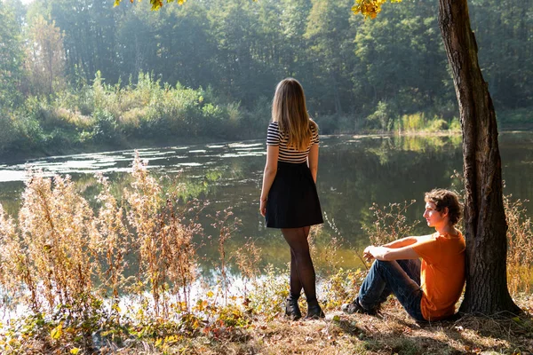 Young Woman Her Man Sitting Lake Autumn Forest — Stockfoto