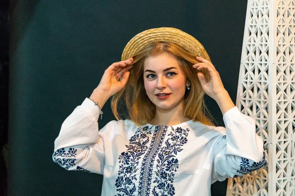Young Woman Wearing Wicker Hat Embroidered Shirt Posing Studio — стоковое фото
