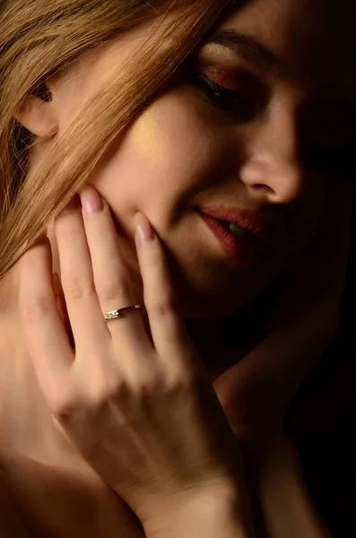 beautiful woman with engagement ring on hand