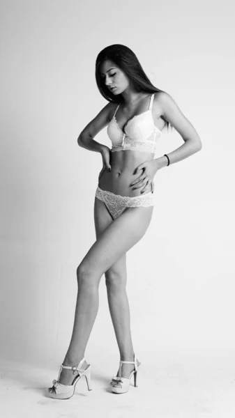 Girl in lingerie on white background — Stok Foto