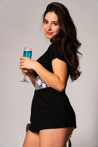 Portrait of disconcerted young woman in light clothes looking aside covering nose with hand isolated on white wall background in studio. People sincere emotions, lifestyle concept. Mock up copy space — Stock Photo, Image