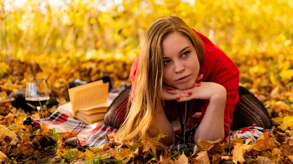 Incredible stunning girl in a red dress. The background is fantastic autumn. Artistic photography. — Stock Photo, Image