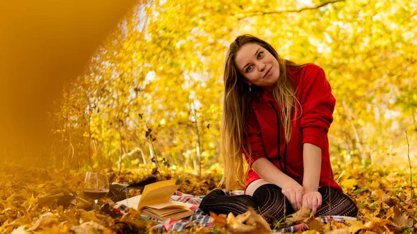 Incredible stunning girl in a red dress. The background is fantastic autumn. Artistic photography. — Stock Photo, Image