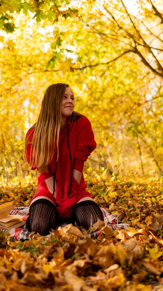 Incredible stunning girl in a red dress. The background is fantastic autumn. Artistic photography. — Stock Photo, Image