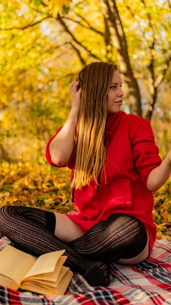 Incredible stunning girl in a red dress. The background is fantastic autumn. Artistic photography. — Stock Photo, Image