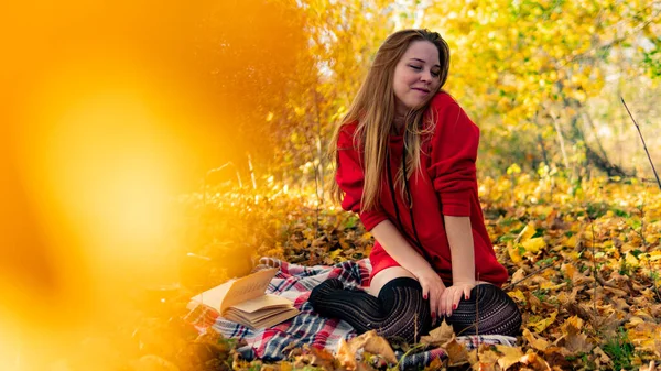 Incredible stunning girl in a red dress. The background is fantastic autumn. Artistic photography. — Stock Photo, Image