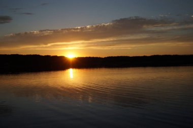 picturesque view of endless sea with beautiful sunrise at sky 