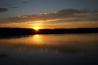 picturesque view of endless sea with beautiful sunrise at sky 