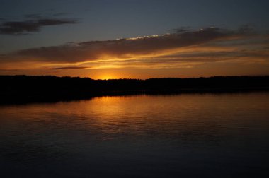 picturesque view of endless sea with beautiful sunrise at sky 