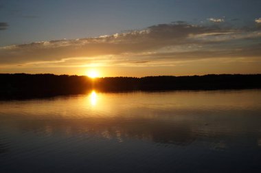 picturesque view of endless sea with beautiful sunrise at sky 