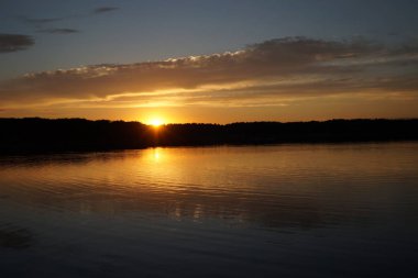 picturesque view of endless sea with beautiful sunrise at sky 