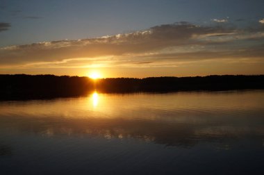 picturesque view of endless sea with beautiful sunrise at sky 