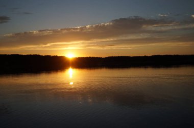 picturesque view of endless sea with beautiful sunrise at sky 