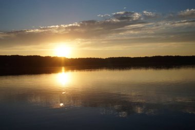 picturesque view of endless sea with beautiful sunrise at sky 