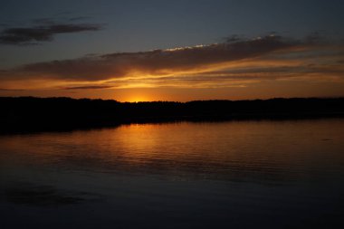picturesque view of endless sea with beautiful sunrise at sky 
