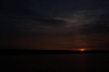 picturesque view of endless sea with beautiful sunrise at sky 