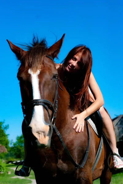 Attractive Young Woman Posing Camera Countryside Sitting Horse Royalty Free Stock Images