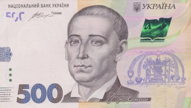 A lot of Ukrainian hryvnias, face value 500 hryvnias on a black background, nicely laid out money on black