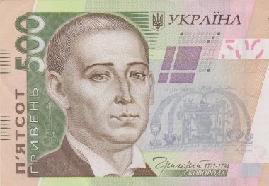 A lot of Ukrainian hryvnias, face value 500 hryvnias on a black background, nicely laid out money on black