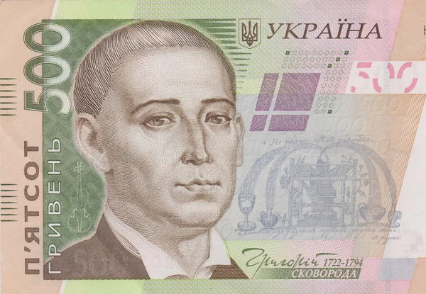 A lot of Ukrainian hryvnias, face value 500 hryvnias on a black background, nicely laid out money on black